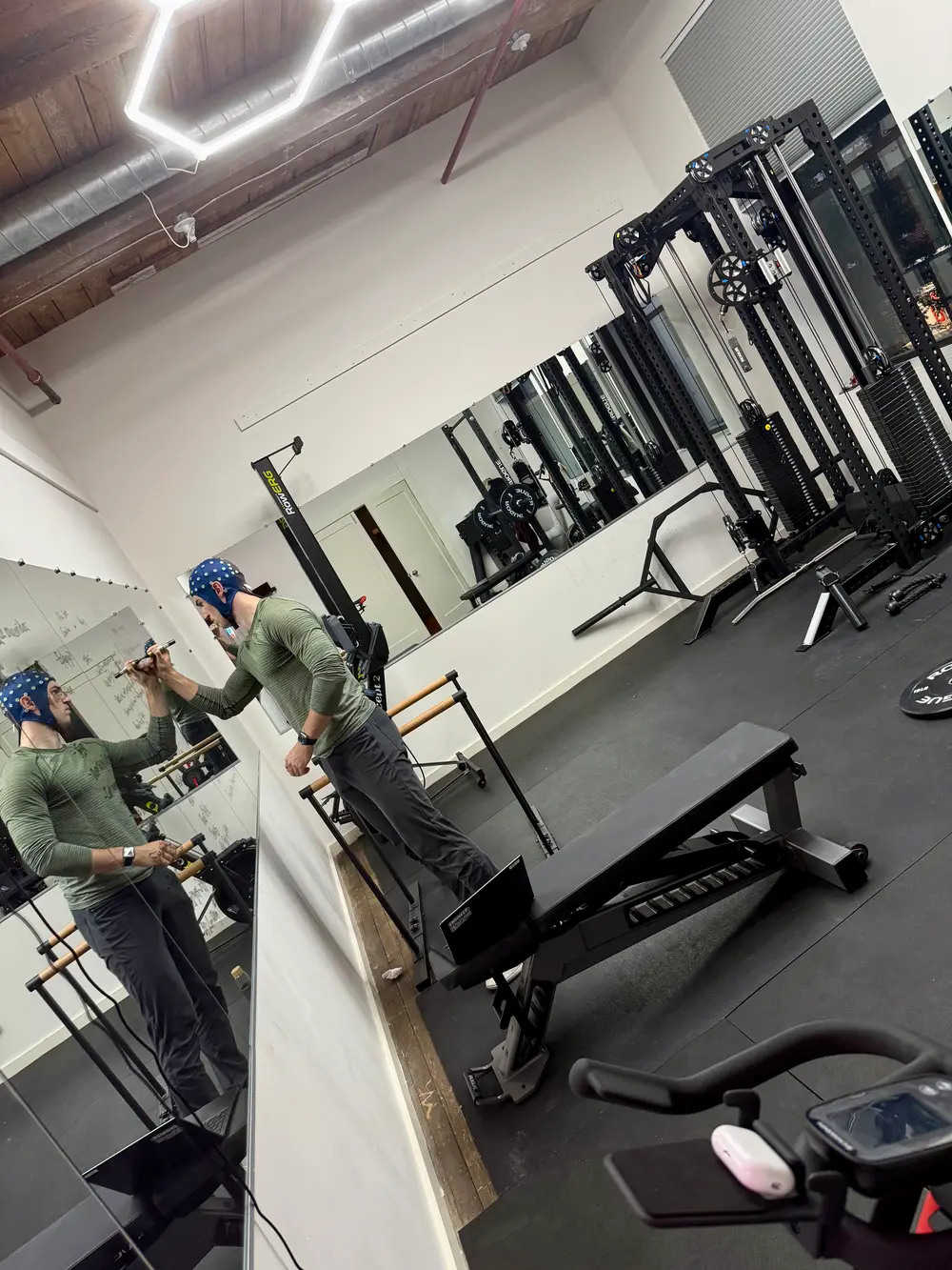 Wearing an EEG electrode cap in a gym mirror